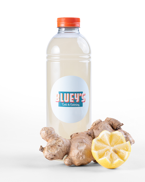 Bottle of BLUEY'S fresh ginger lemonade,  a product in the BLUEY'S Catering offering that can be delivered to your office in Amsterdam